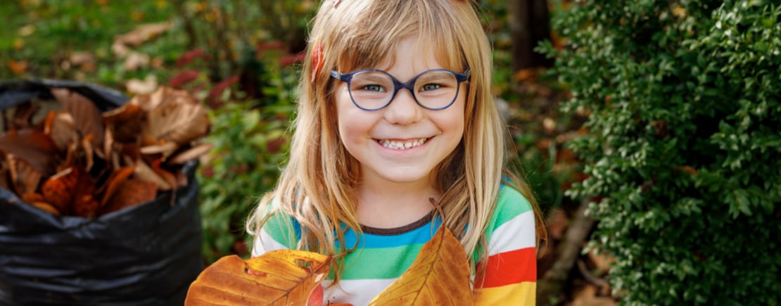 girl wearing glasses smiling