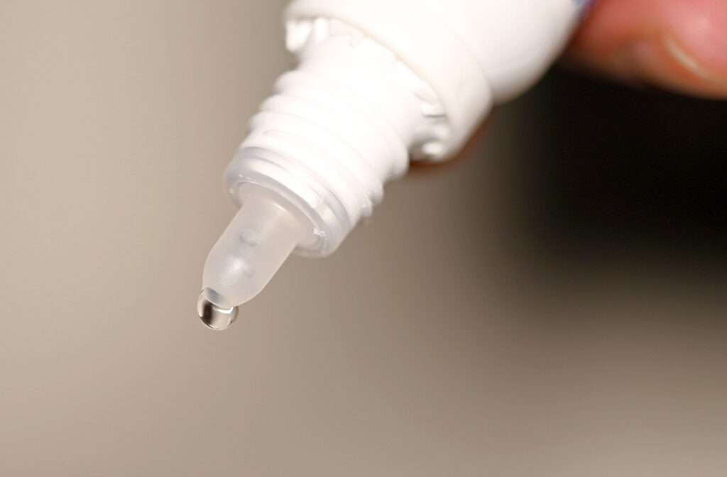 Close-up of liquid coming out of the end of an eye dropper.